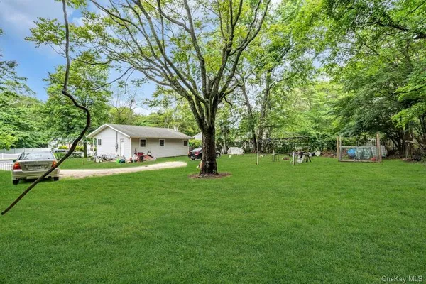 a view of a house with a backyard porch and sitting area