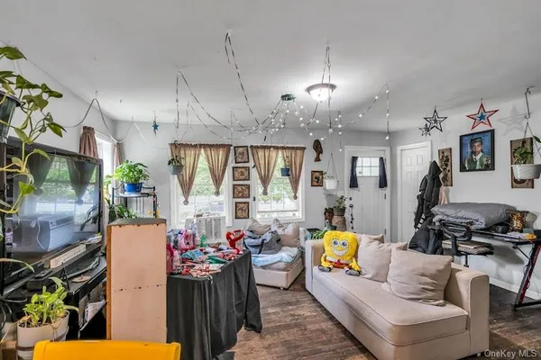 a kitchen with stainless steel appliances granite countertop a refrigerator a stove and white cabinets