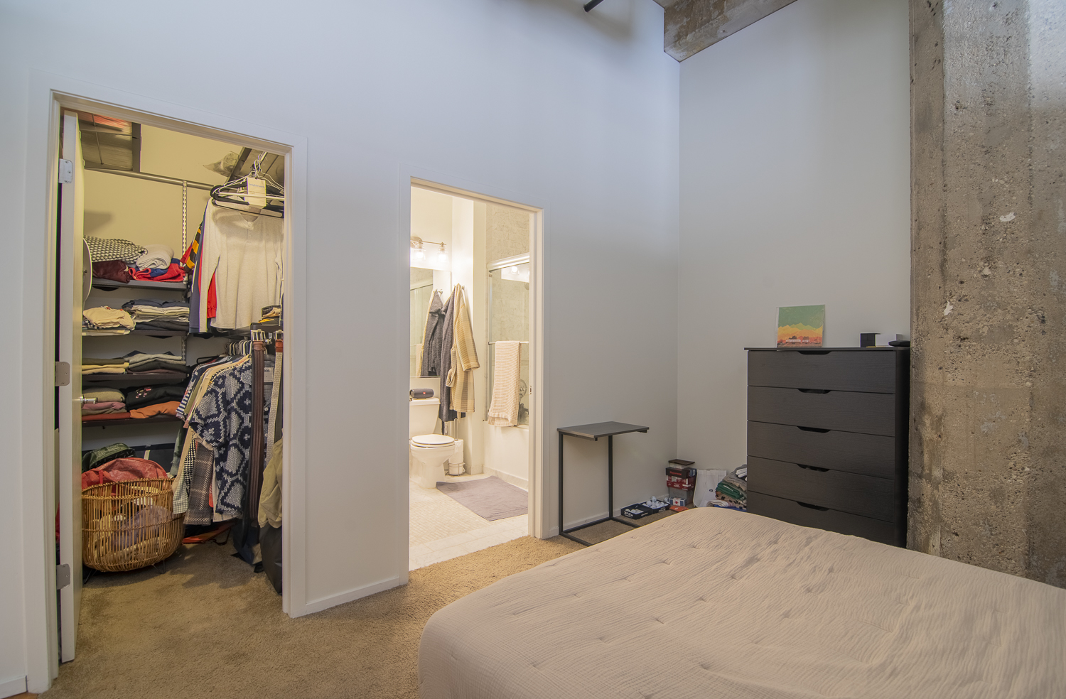 817 West Washington Boulevard, Unit 102 Chicago, IL 60607 - Photo 8 of 10 a bedroom with a bed and a closet