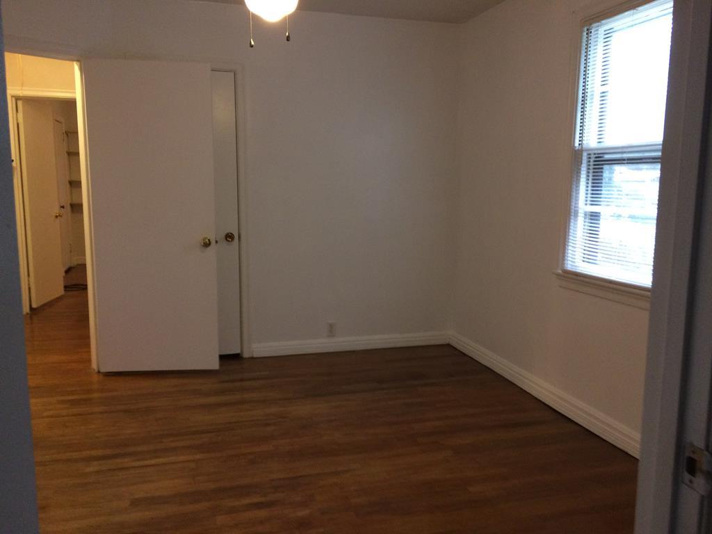 2833 Christine Road Columbus, GA 31907 - Photo 10 of 18 an empty room with wooden floor and windows
