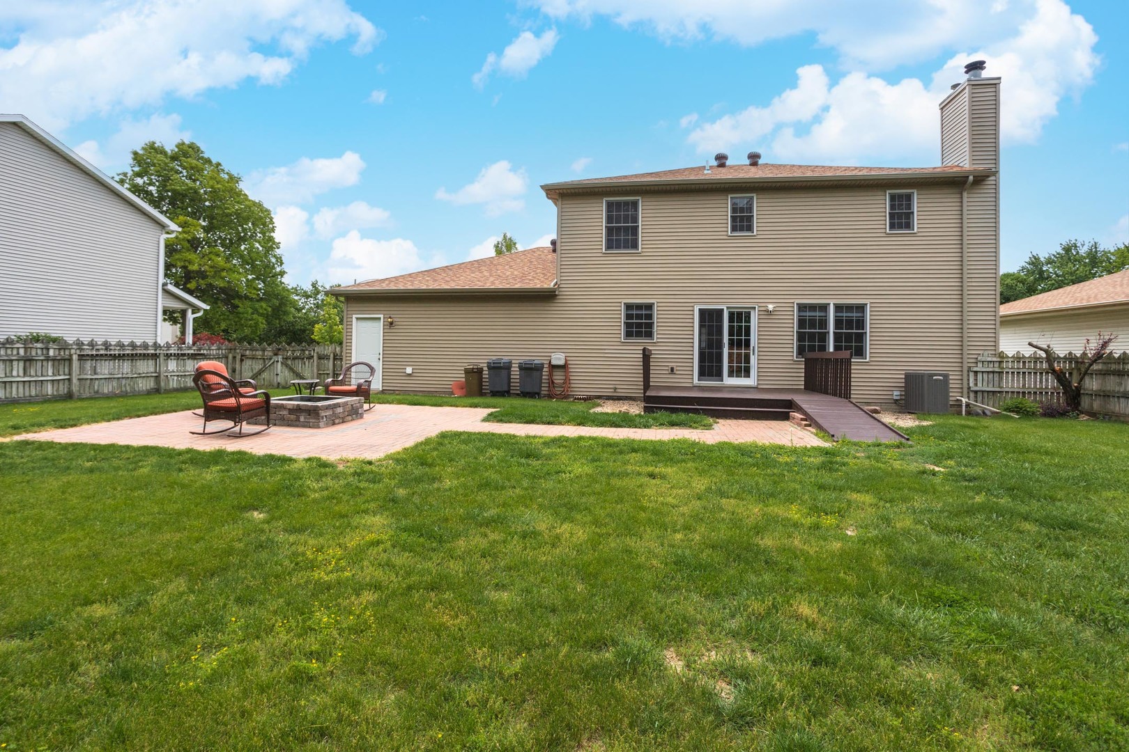 814 Landau Lane Normal, IL 61761 - Photo 46 of 58 a view of a house with a backyard and a patio