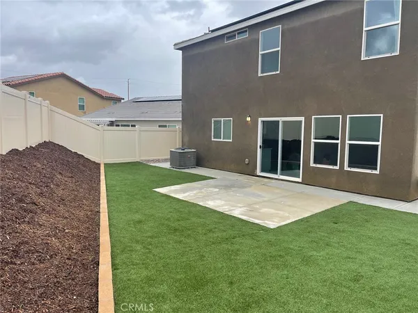 a backyard of a house with large lots of green space