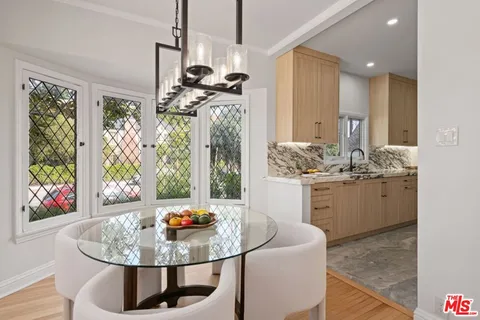a counter top with white cabinets and a sink