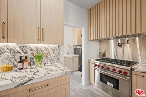 a utility room with sink dryer and washer