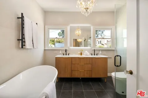 a view of a livingroom with wooden floor and entryway