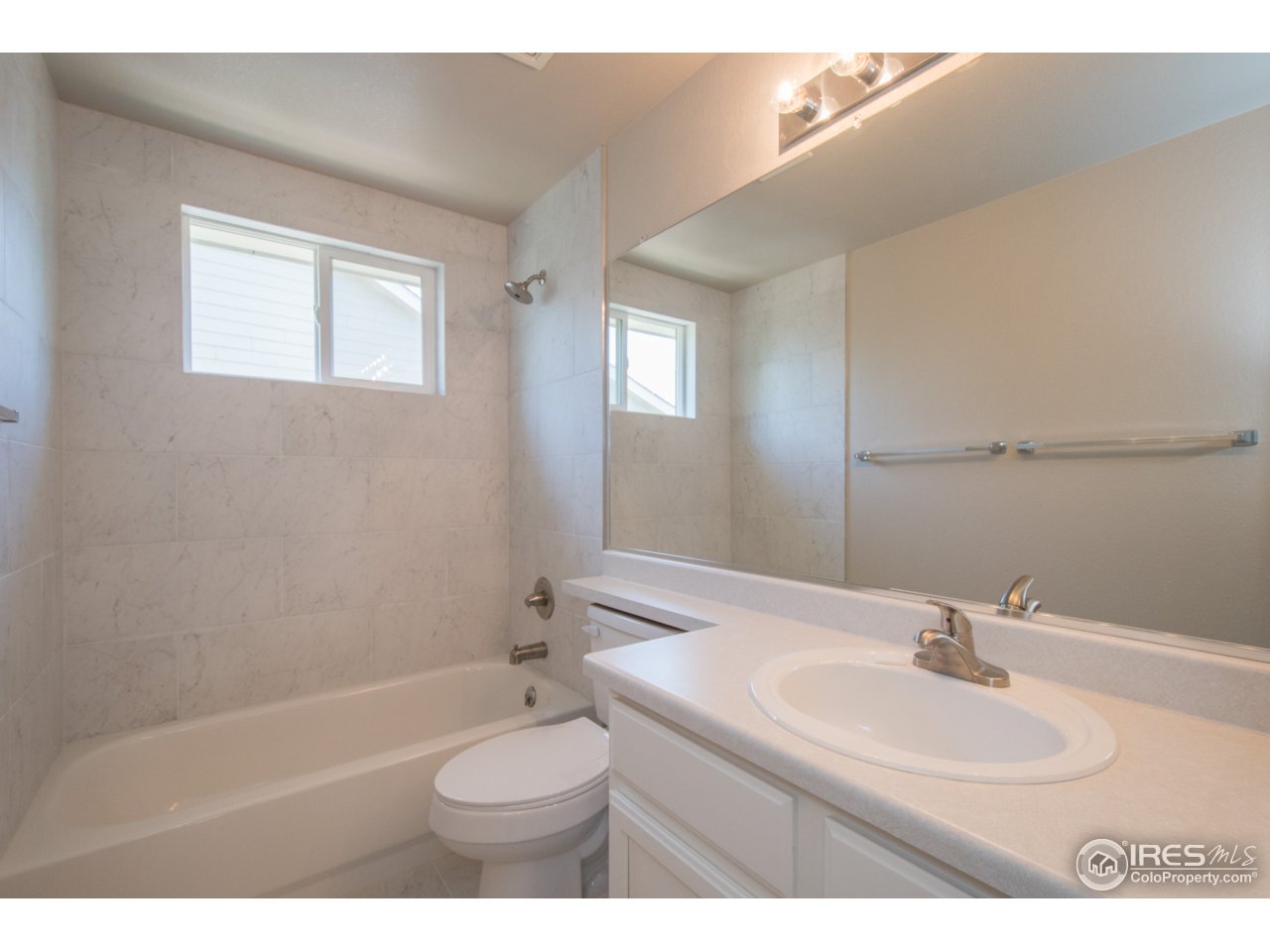 519 Flagler Road Fort Collins, CO 80525 - Photo 16 of 28 Hallway Bathroom - New Tile