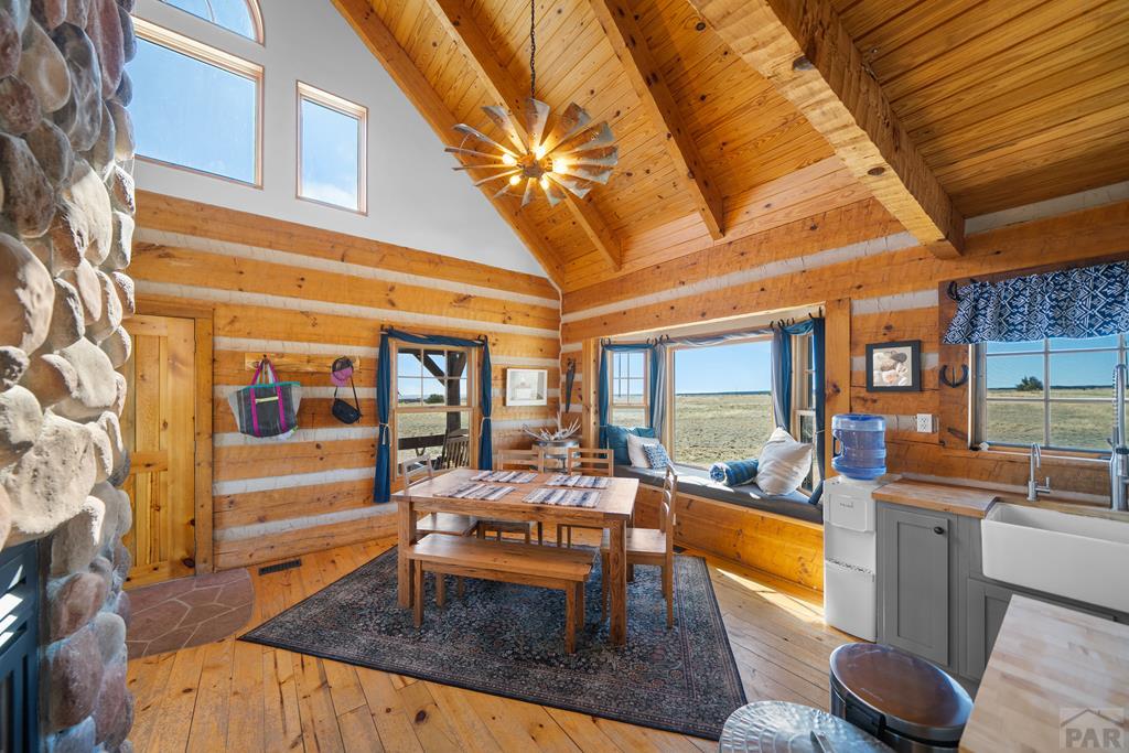 965 Newton Road Pueblo, CO 81005 - Photo 13 of 47 a living room with fireplace furniture and a large window