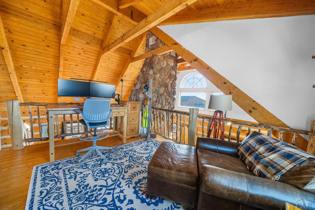965 Newton Road Pueblo, CO 81005 - Photo 14 of 47 a living room with chairs and a rug