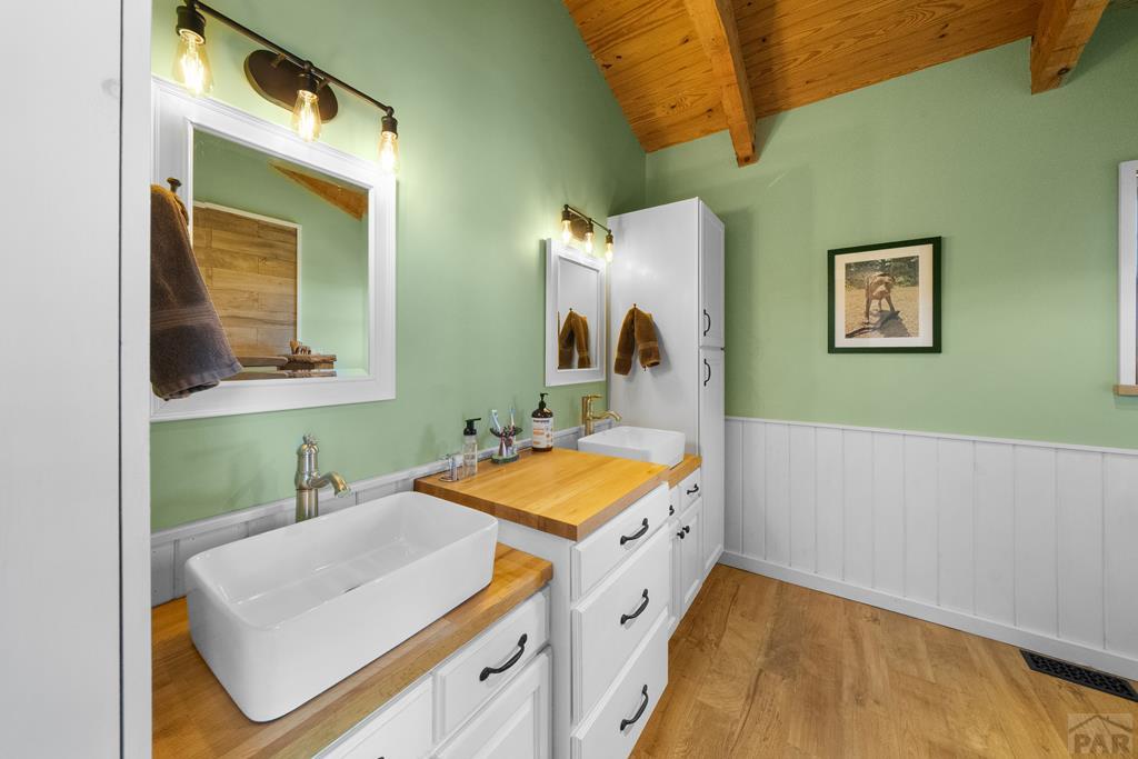 965 Newton Road Pueblo, CO 81005 - Photo 19 of 47 a bathroom with a sink and a mirror