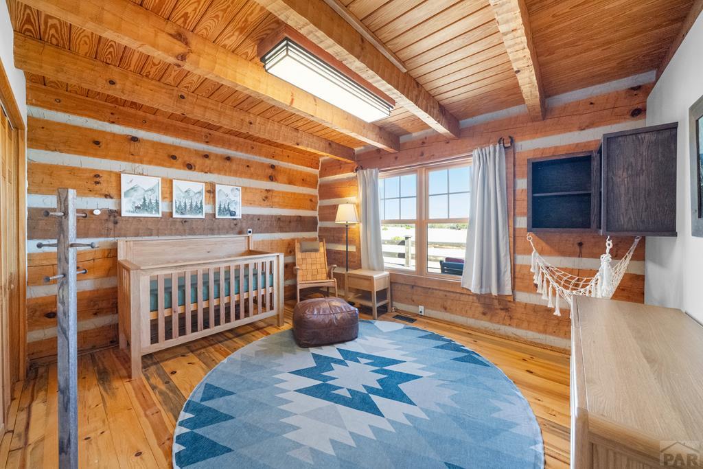 965 Newton Road Pueblo, CO 81005 - Photo 20 of 47 a bedroom with furniture and a window