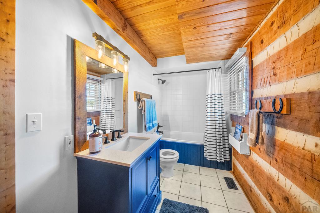 965 Newton Road Pueblo, CO 81005 - Photo 21 of 47 a bathroom with a sink a mirror and shower