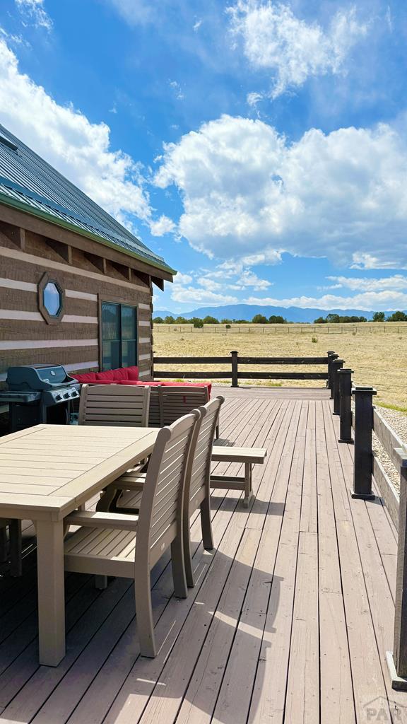 965 Newton Road Pueblo, CO 81005 - Photo 29 of 47 a roof deck with a table and chairs