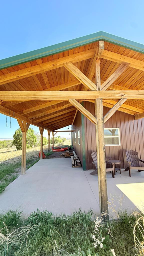 965 Newton Road Pueblo, CO 81005 - Photo 33 of 47 a backyard of a house with yard and outdoor seating