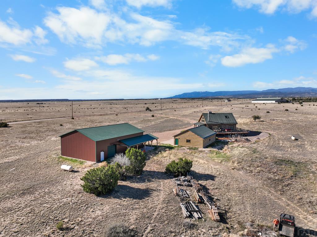 965 Newton Road Pueblo, CO 81005 - Photo 44 of 47 an aerial view of a house with beach and ocean view