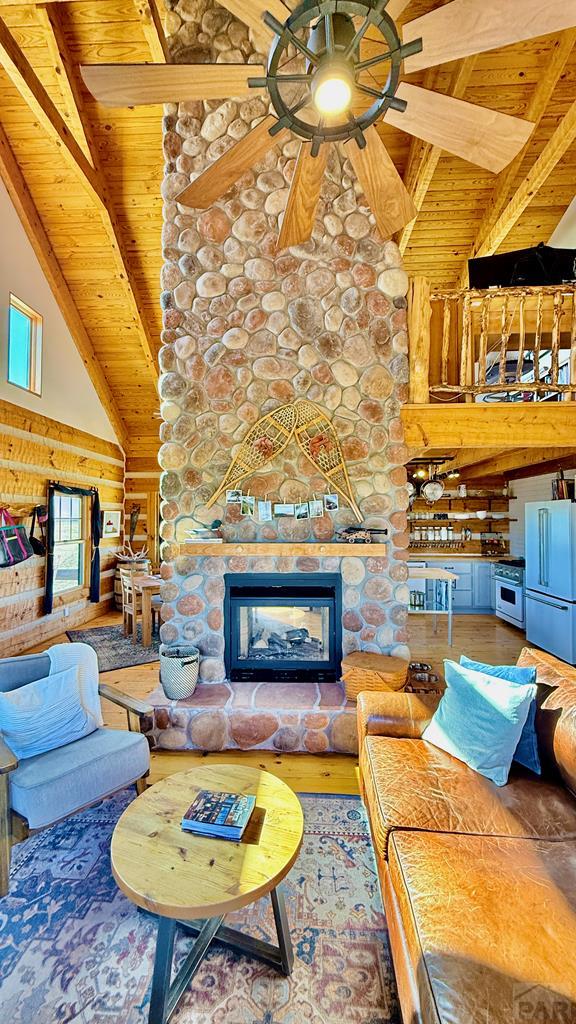 965 Newton Road Pueblo, CO 81005 - Photo 6 of 47 a living room with furniture and a fireplace