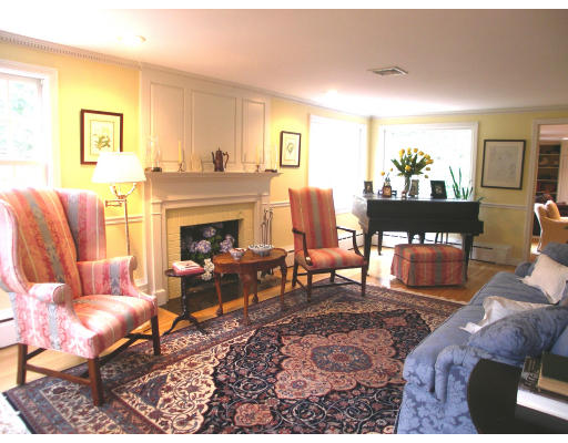 74 Pinecroft Road Weston, MA 02493 - Photo 3 of 25 a living room with furniture fireplace and window
