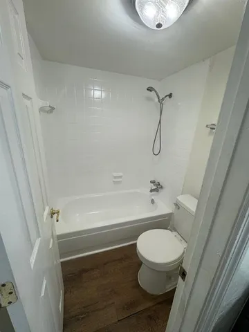a view of bathroom with bathtub and shower