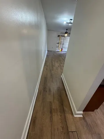 a kitchen with stainless steel appliances a refrigerator and a stove top oven