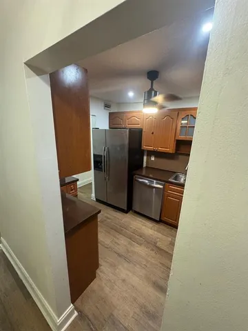 a view of storage and utility room with refrigerator
