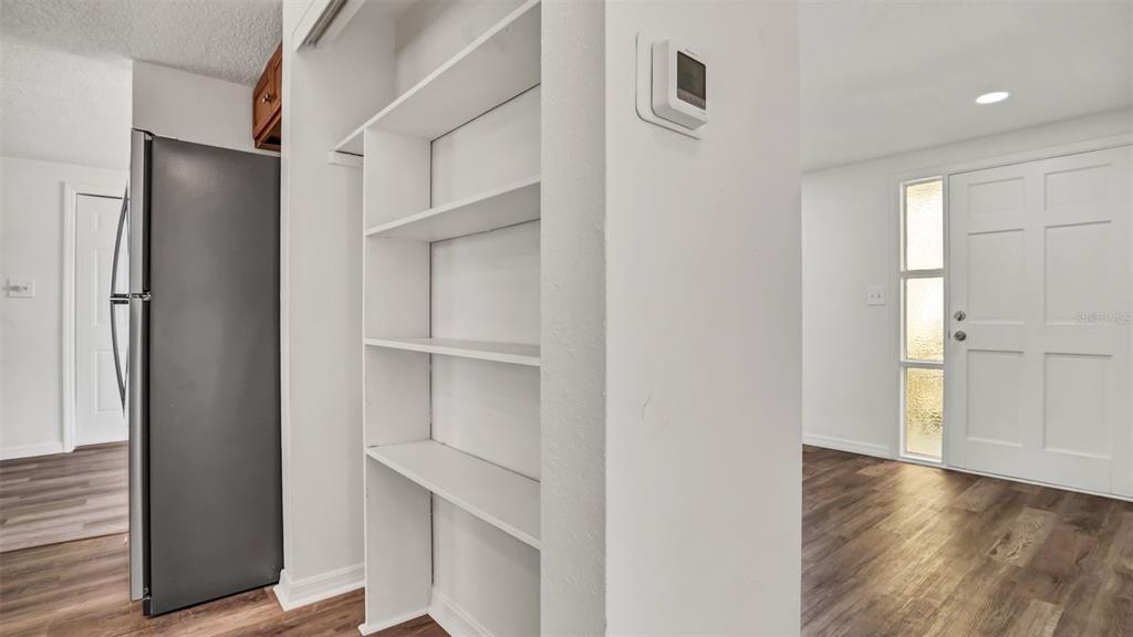 7124 Parrot Drive Port Richey, FL 34668 - Photo 12 of 29 a view of walk in closet with empty racks