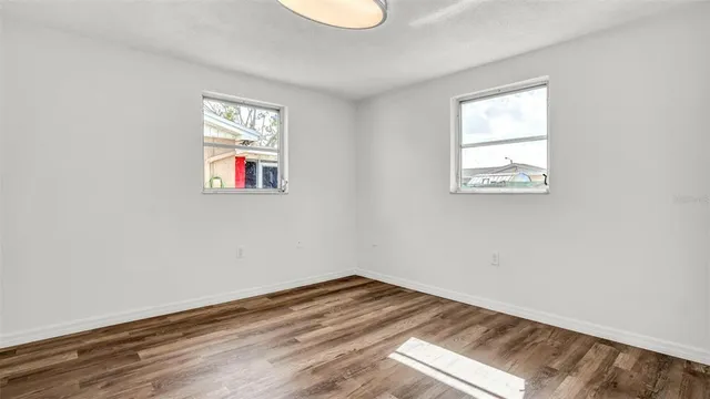 an empty room with windows