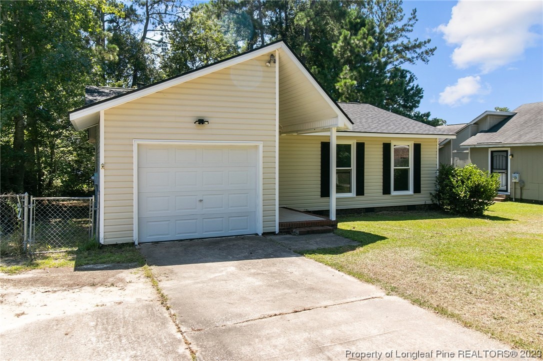 3306 Arrowhead Road Spring Lake, NC 28390 - Photo 2 of 29 a view of a house with backyard and garden