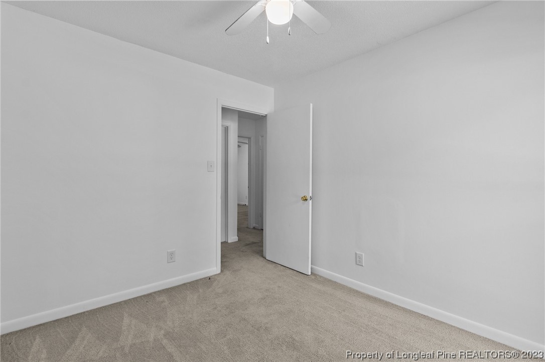 3306 Arrowhead Road Spring Lake, NC 28390 - Photo 21 of 29 an empty room with a ceiling fan and a window