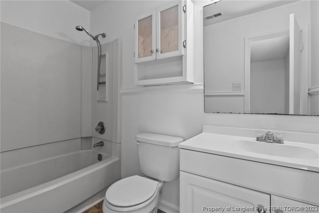3306 Arrowhead Road Spring Lake, NC 28390 - Photo 24 of 29 a bathroom with a sink toilet and shower