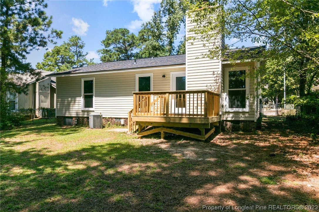 3306 Arrowhead Road Spring Lake, NC 28390 - Photo 28 of 29 a view of a house with backyard and sitting area