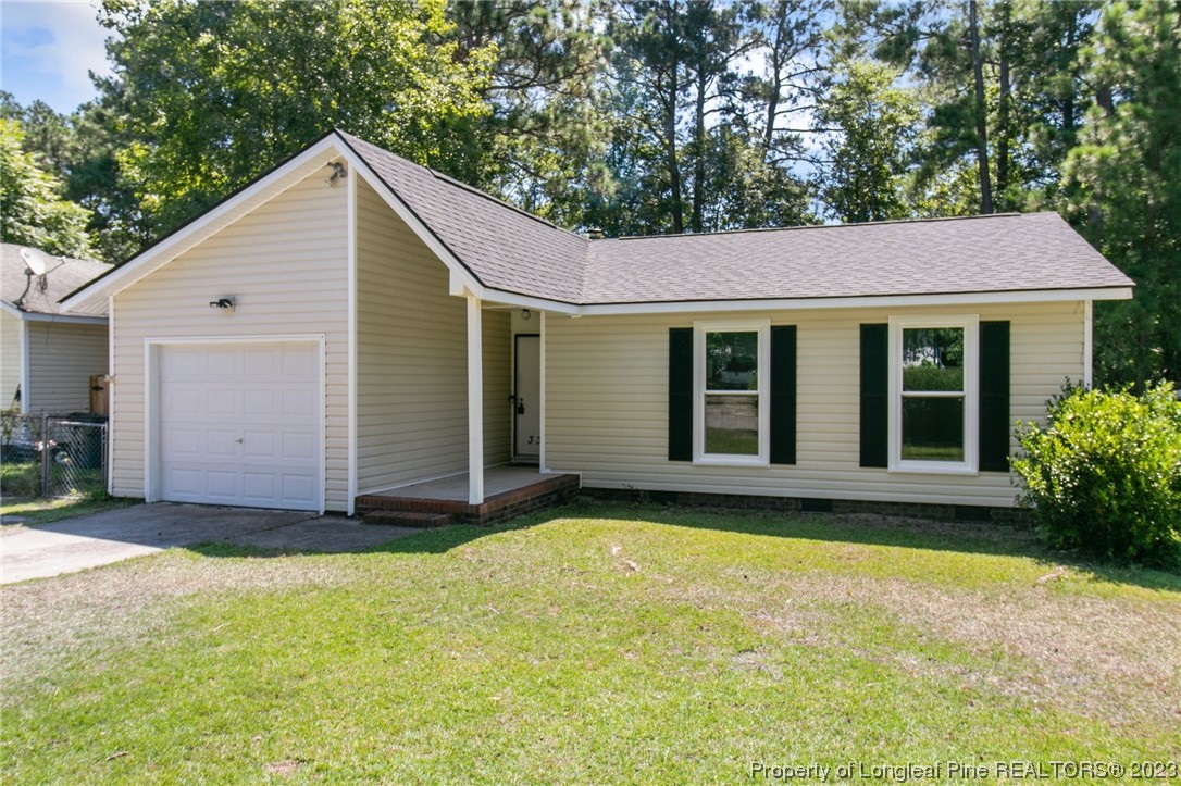 3306 Arrowhead Road Spring Lake, NC 28390 - Photo 3 of 29 a view of a house with backyard and garden