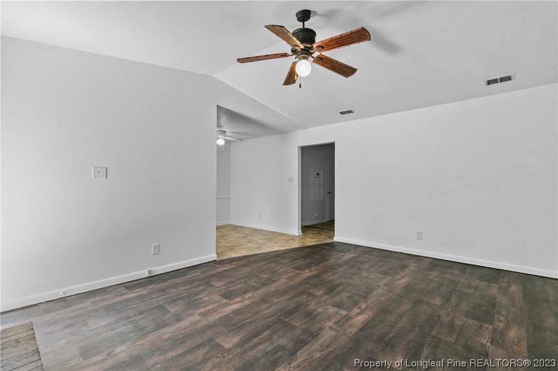 3306 Arrowhead Road Spring Lake, NC 28390 - Photo 9 of 29 an empty room with a ceiling fan and wooden floor
