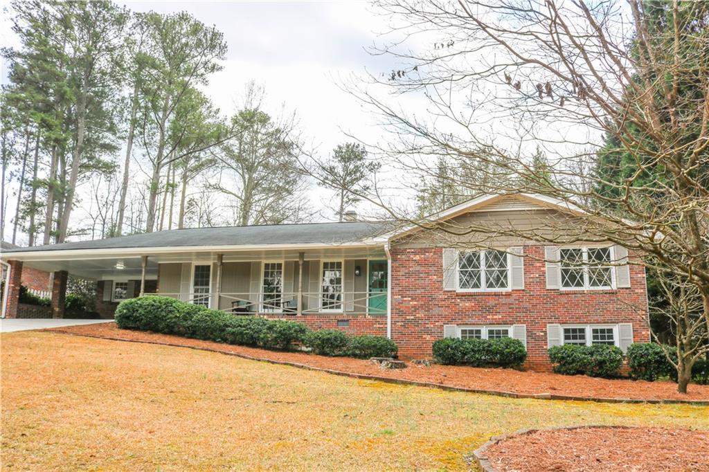 2733 Pangborn Road Decatur, GA 30033 - Photo 1 of 1 a front view of a house with a yard and garage
