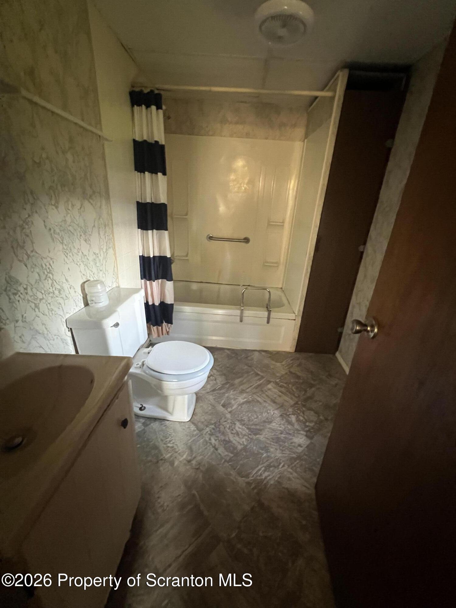 812 Butler Street Dunmore, PA 18512 - Photo 7 of 15 a bathroom with a sink a toilet and shower