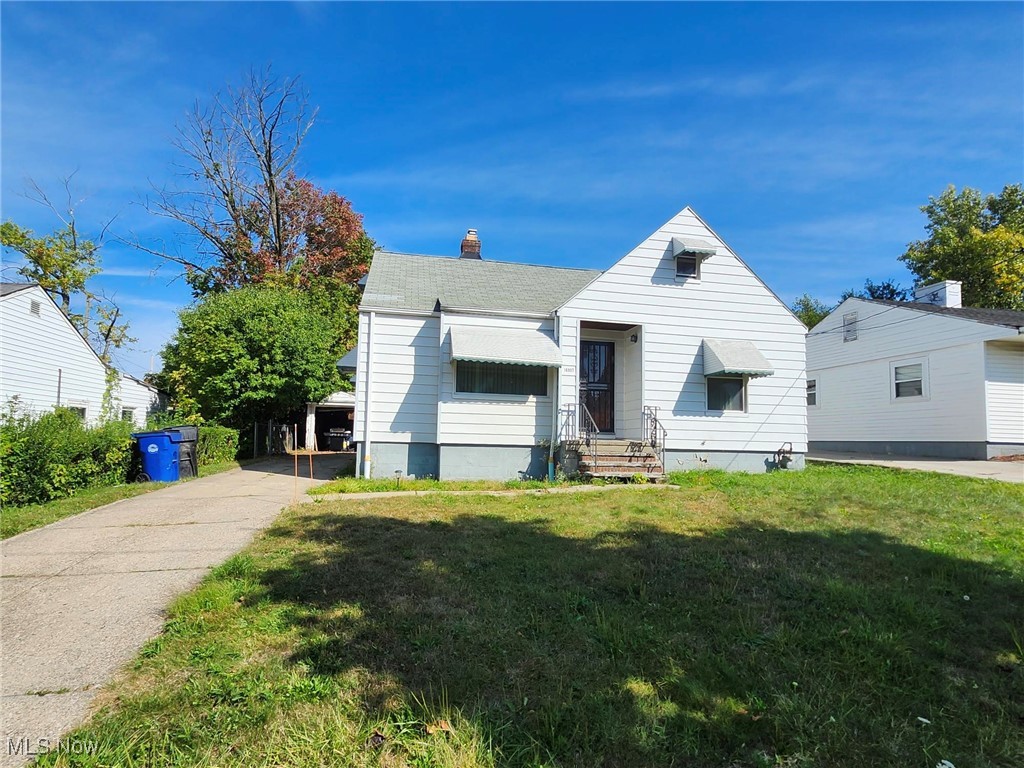 View of front of property with a front yard