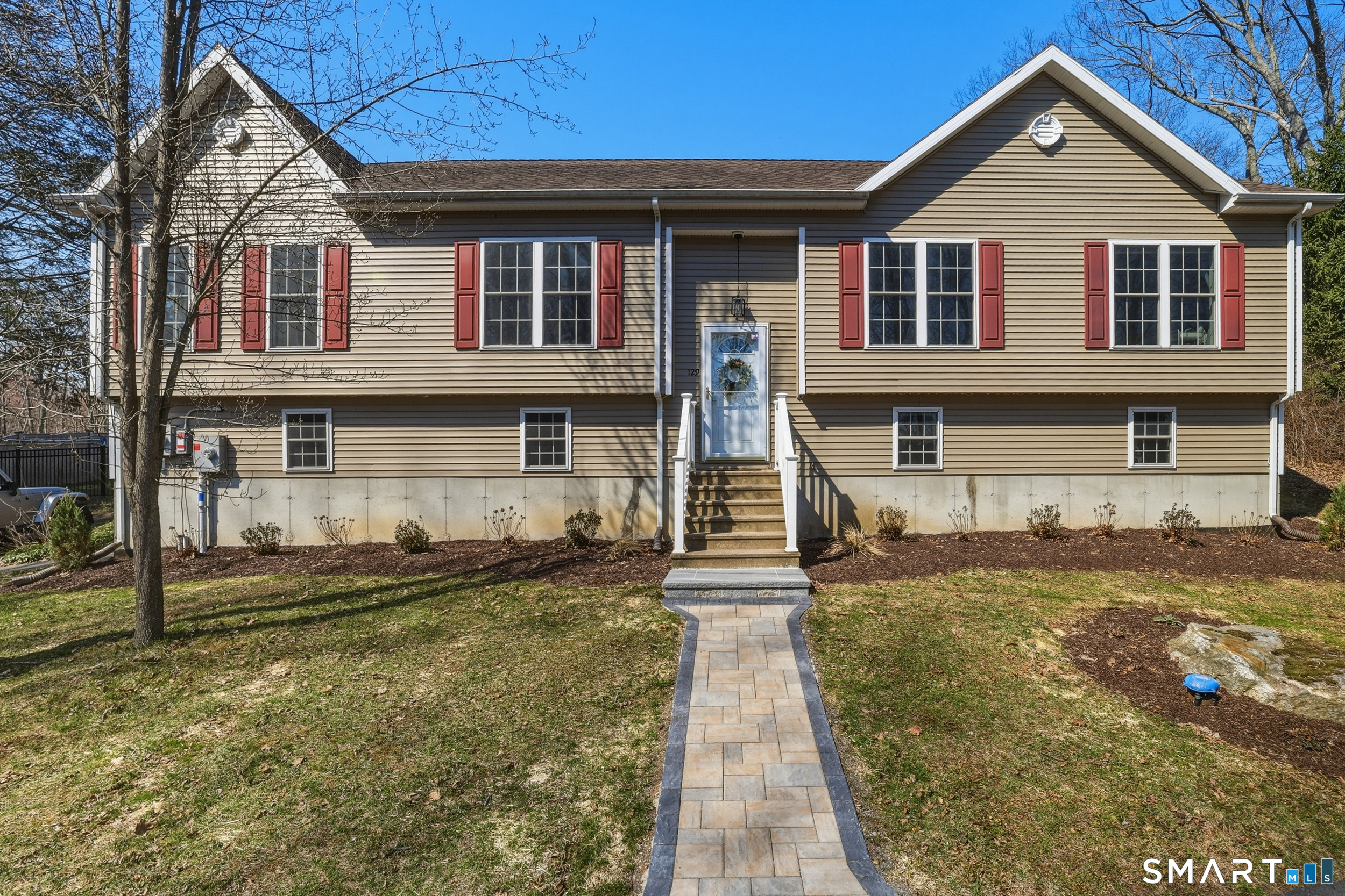 129 North Mountain Road Canton, CT 06019 - Photo 1 of 39 a front view of a house with a yard