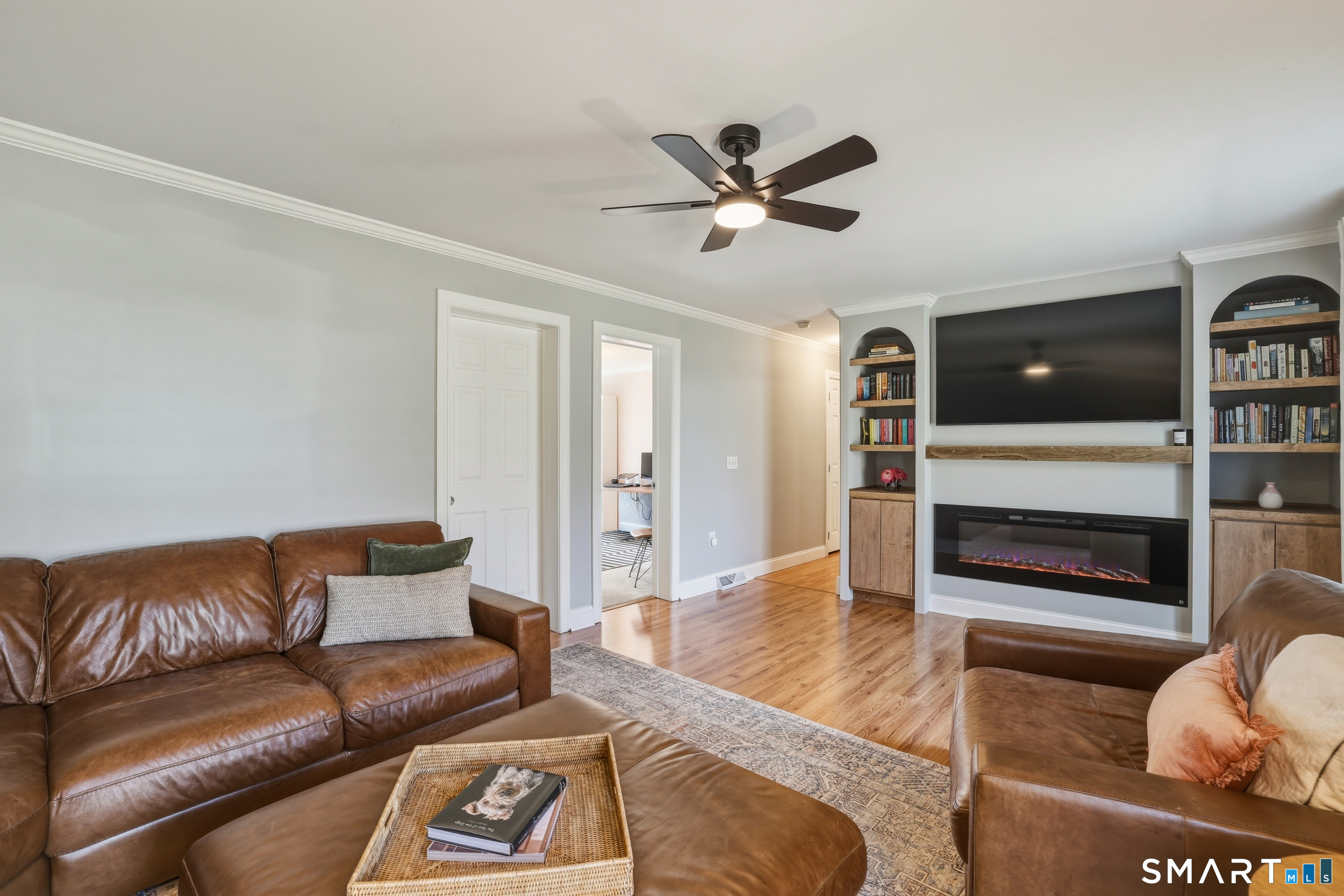 129 North Mountain Road Canton, CT 06019 - Photo 11 of 39 a living room with furniture and a flat screen tv