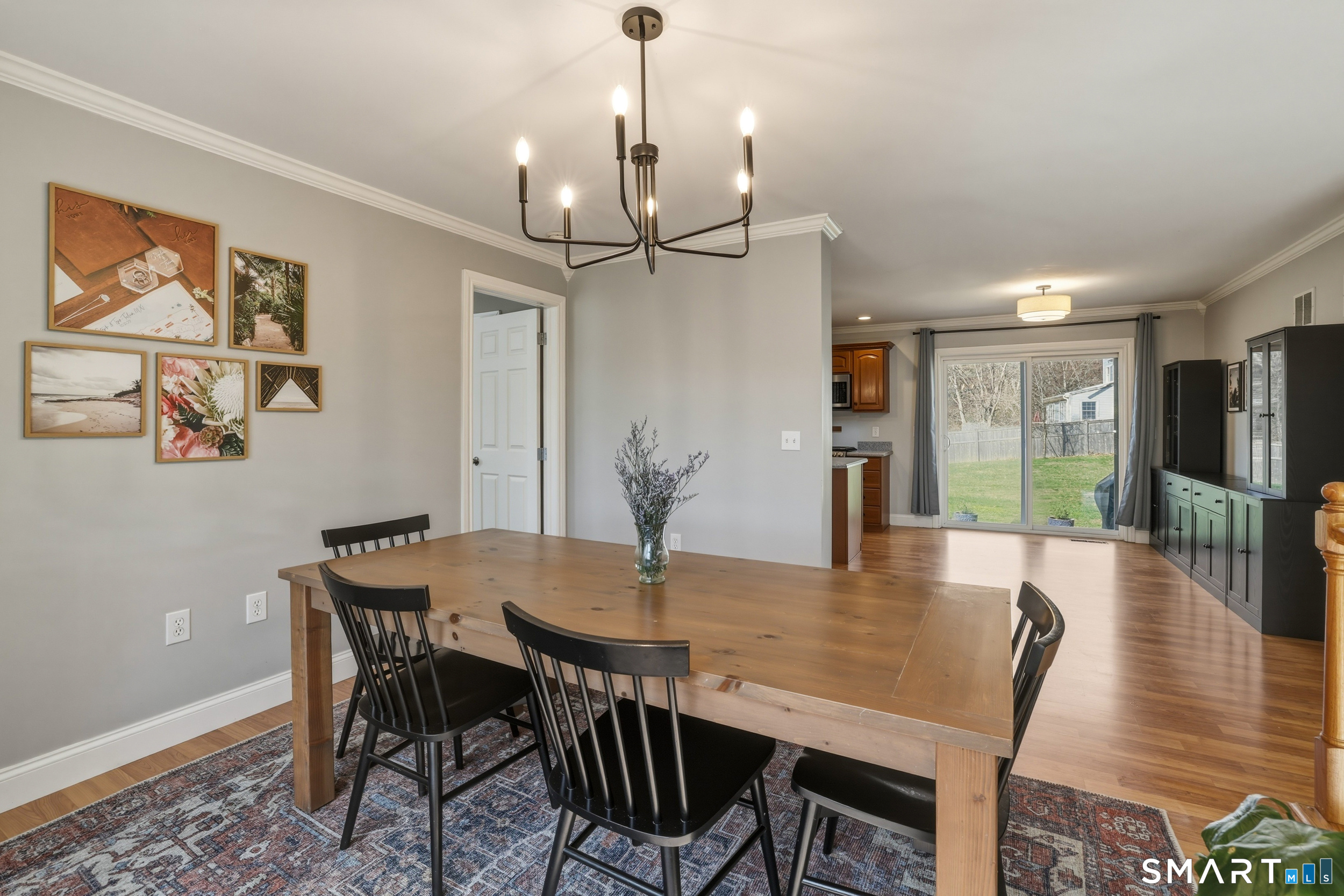 129 North Mountain Road Canton, CT 06019 - Photo 14 of 39 a view of a dining room with furniture wooden floor and chandelier