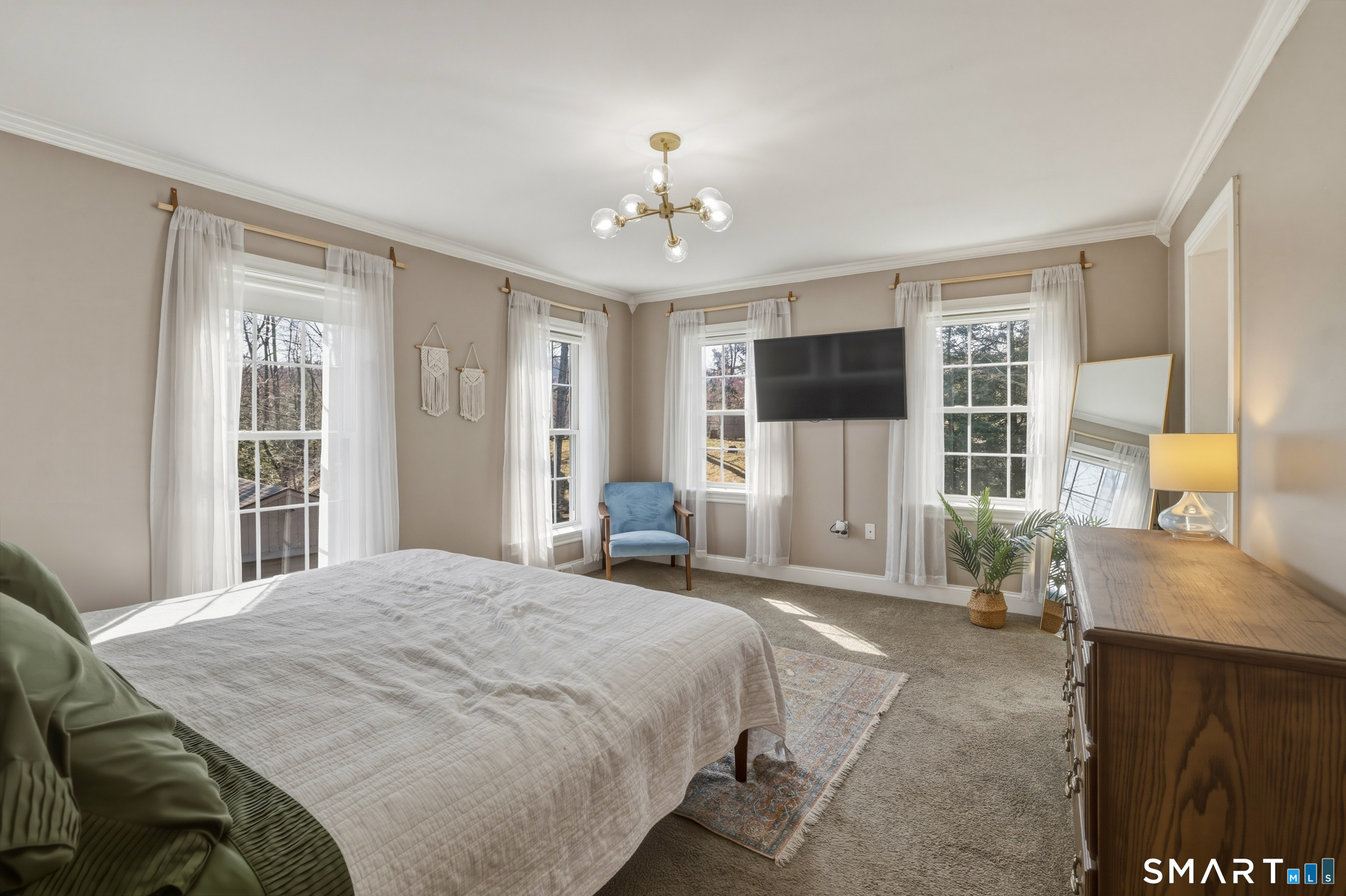 129 North Mountain Road Canton, CT 06019 - Photo 15 of 39 a spacious bedroom with a bed and a flat screen tv