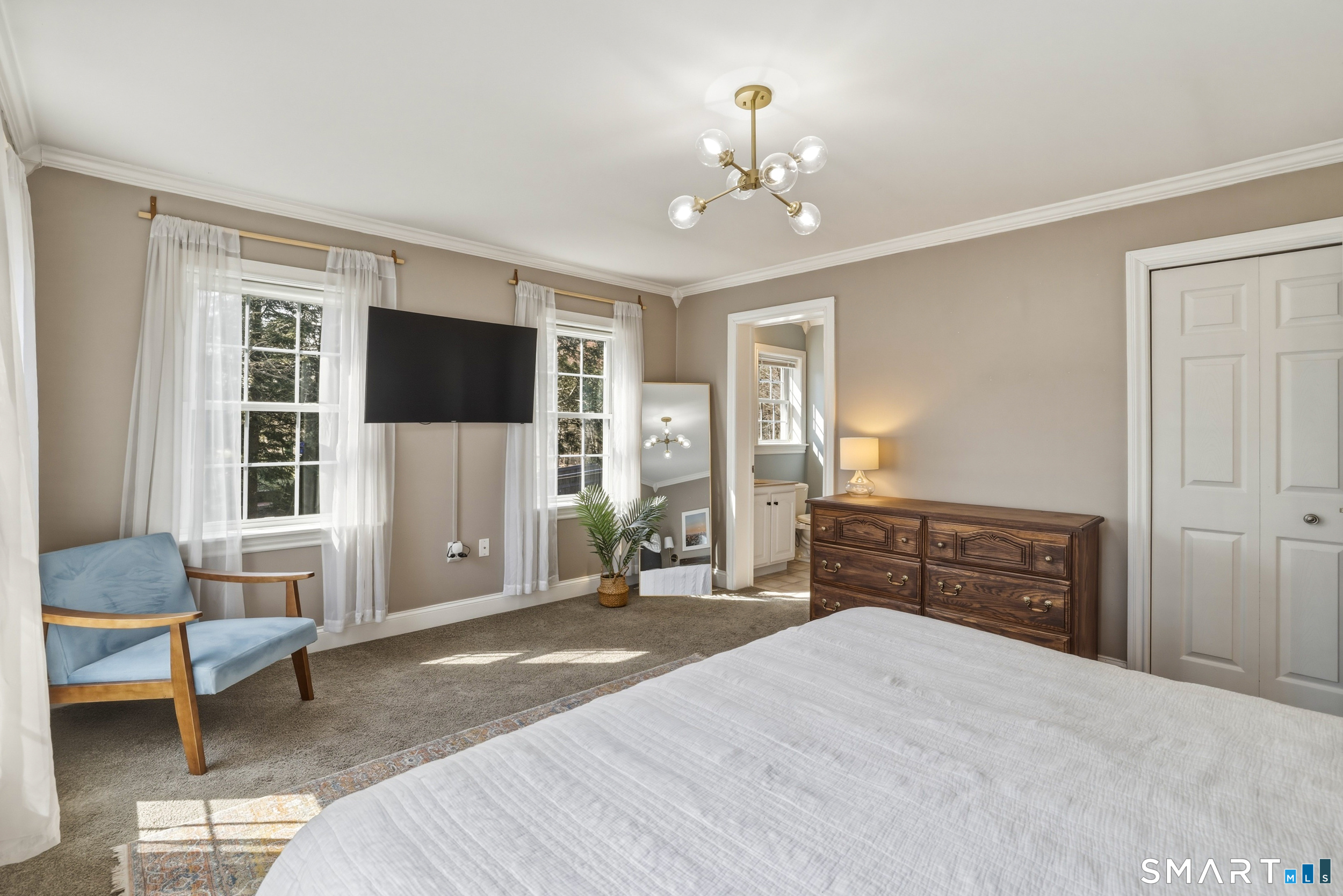 129 North Mountain Road Canton, CT 06019 - Photo 18 of 39 a spacious bedroom with a bed and a flat screen tv