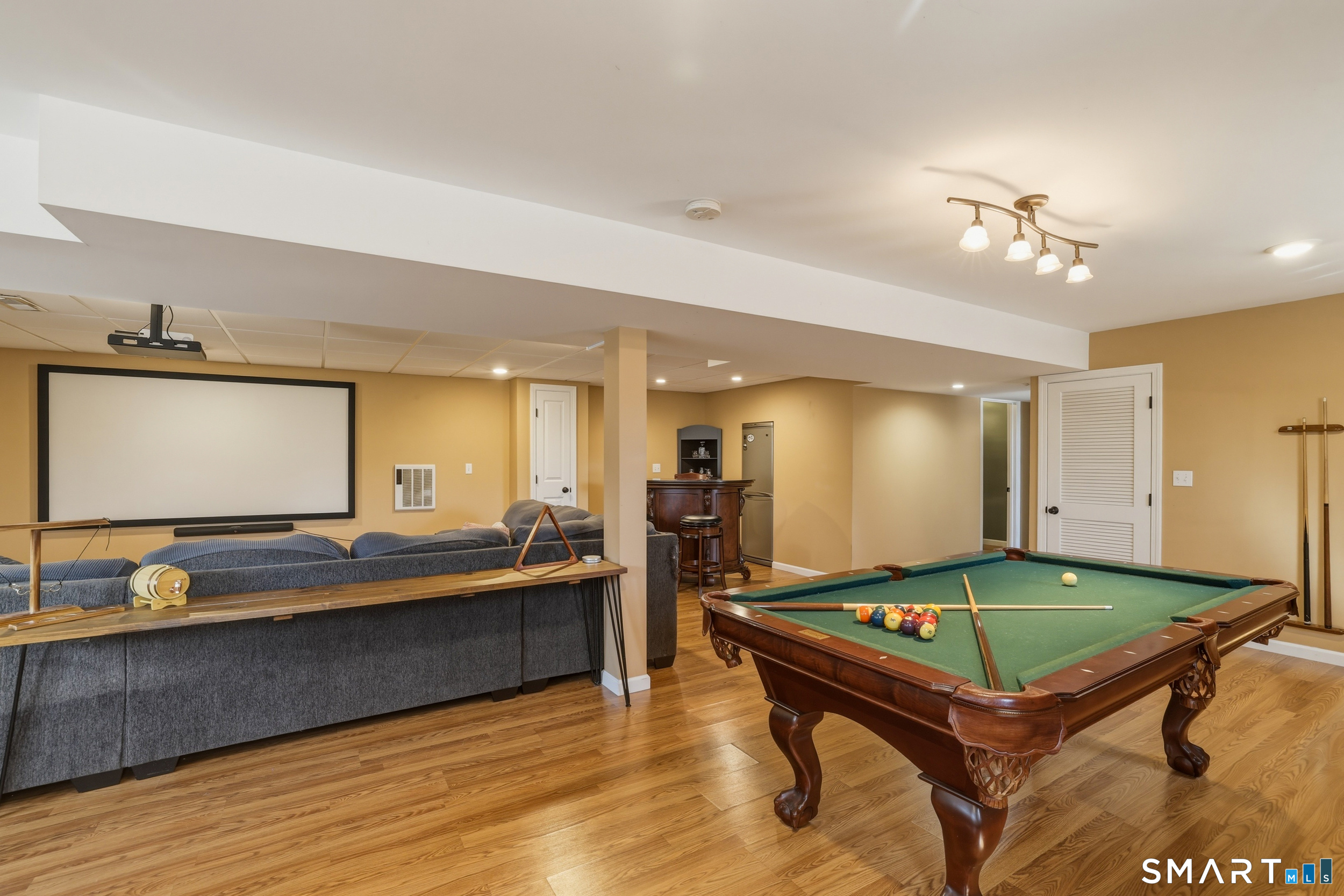 129 North Mountain Road Canton, CT 06019 - Photo 29 of 39 a living room with kitchen pool table and chairs
