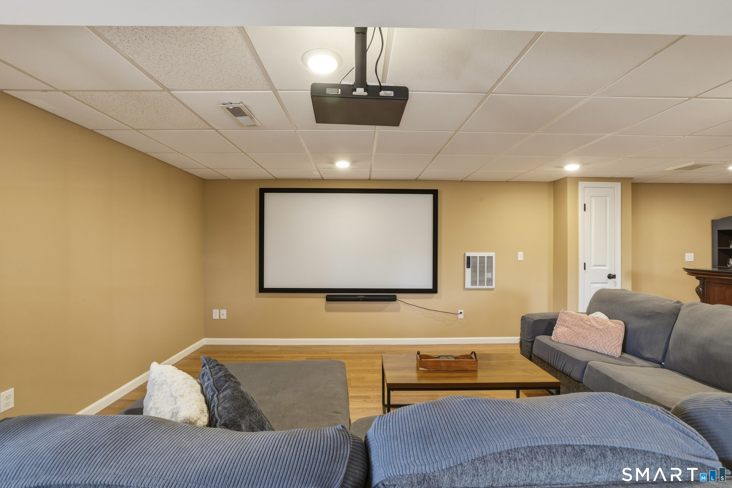 129 North Mountain Road Canton, CT 06019 - Photo 32 of 39 a living room with a couch and a flat screen tv