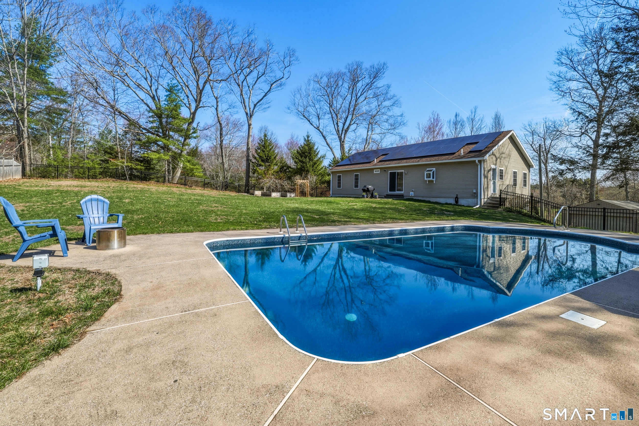 129 North Mountain Road Canton, CT 06019 - Photo 35 of 39 a view of a swimming pool with a patio and a yard