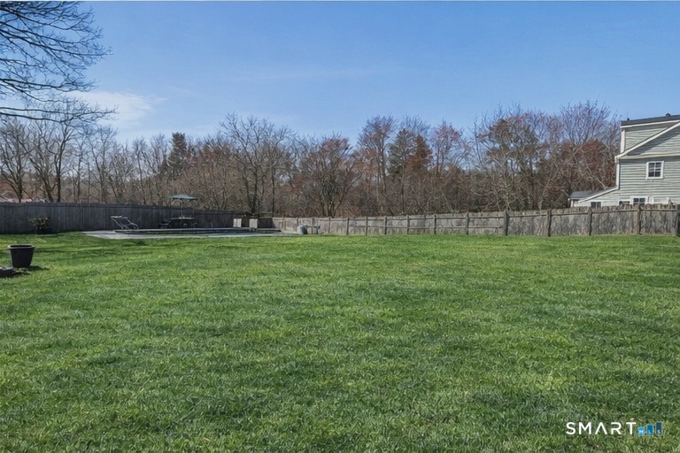 129 North Mountain Road Canton, CT 06019 - Photo 36 of 39 a view of a field with trees in the background