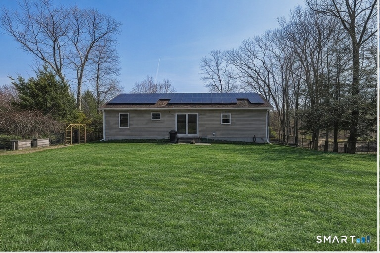 129 North Mountain Road Canton, CT 06019 - Photo 4 of 39 a view of a house with a garden