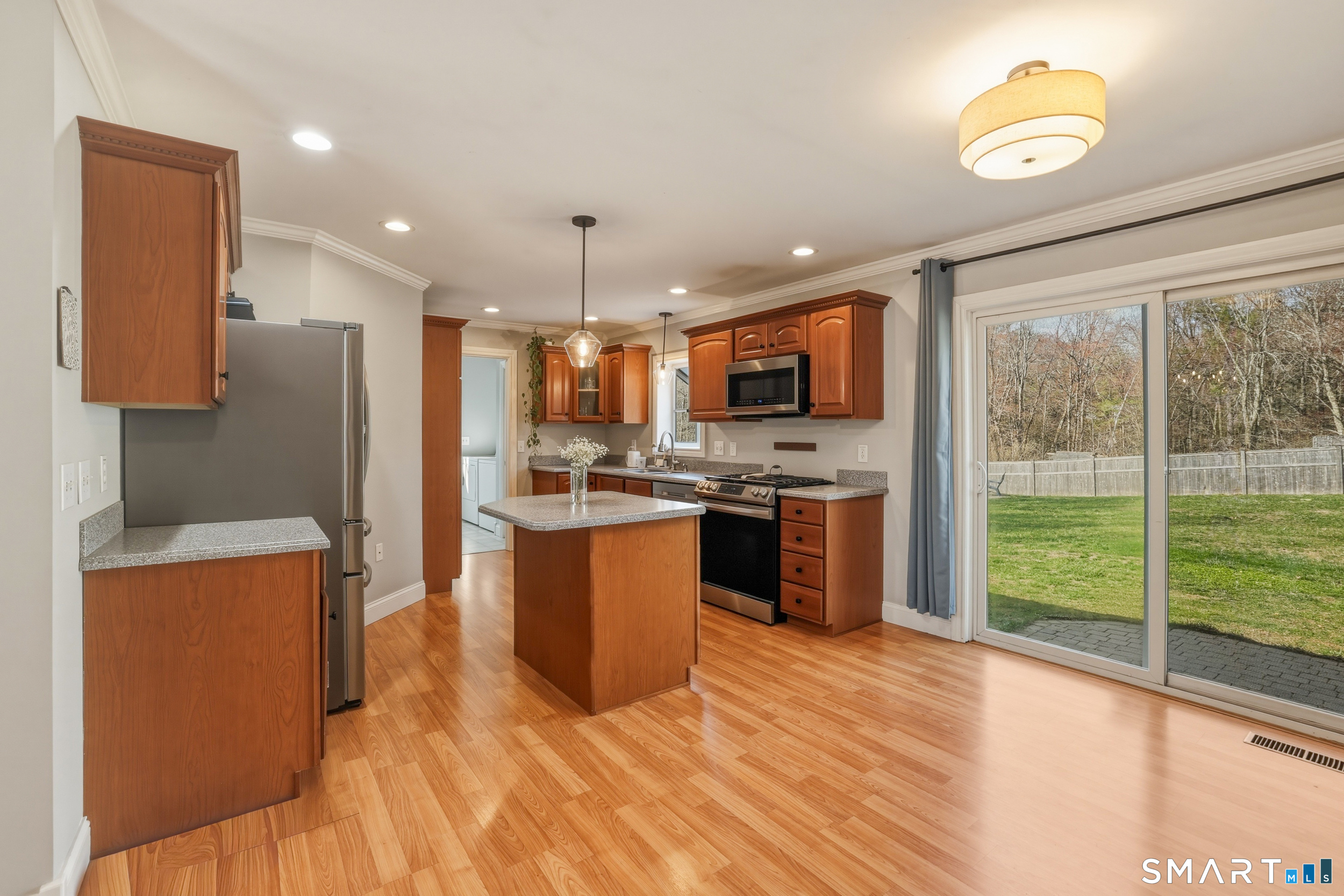 129 North Mountain Road Canton, CT 06019 - Photo 5 of 39 a kitchen with a refrigerator a stove top oven a sink dishwasher and wooden cabinets