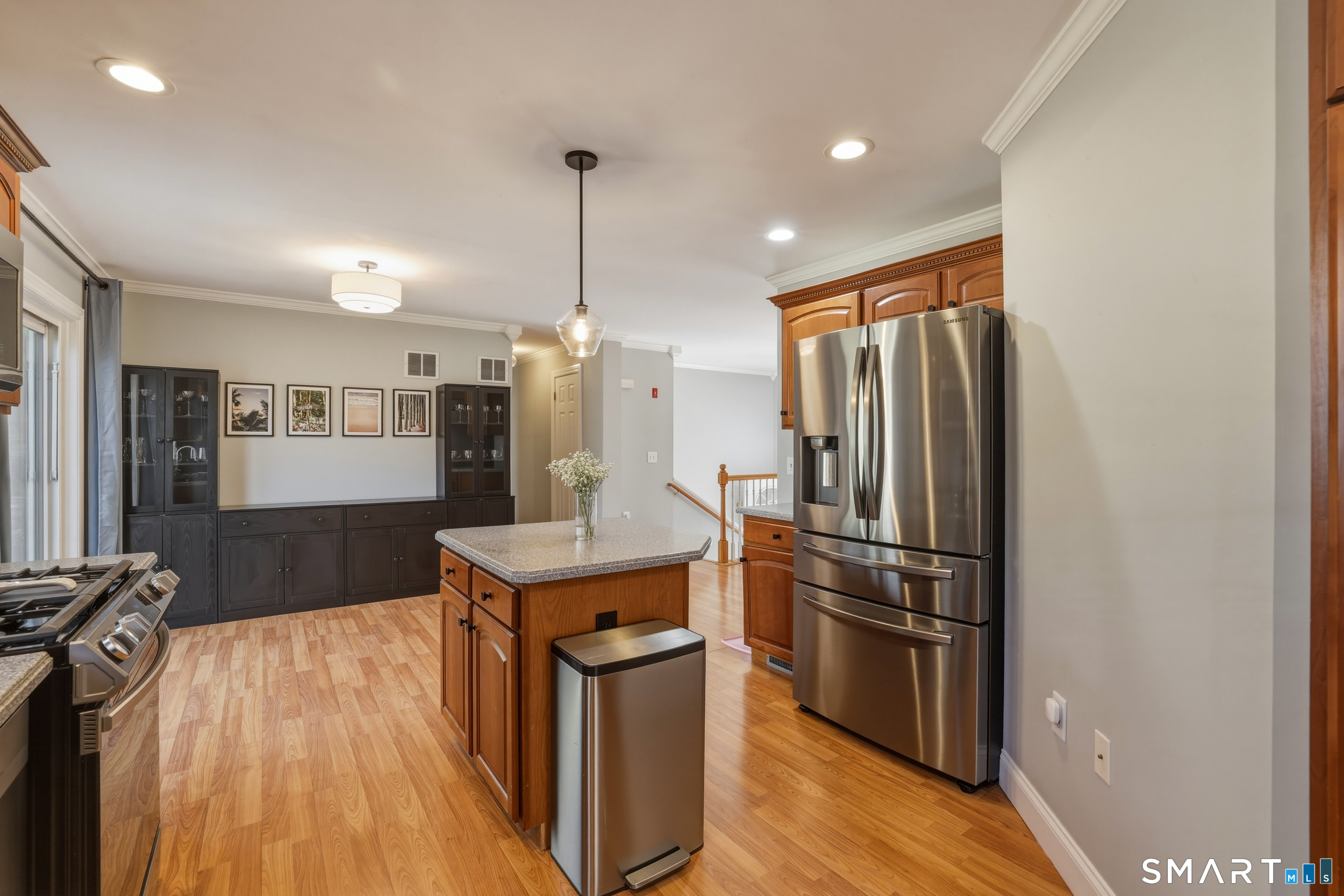 129 North Mountain Road Canton, CT 06019 - Photo 8 of 39 a kitchen with stainless steel appliances granite countertop a refrigerator a sink a stove and a wooden floors