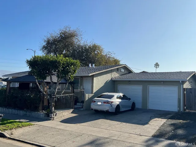 a car parked in front of a house