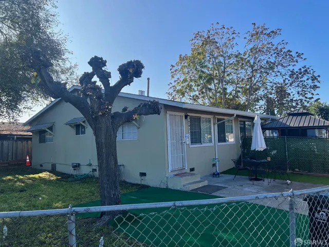 a house view with a backyard space