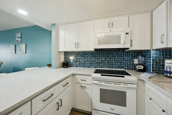 a view of a kitchen with cabinets