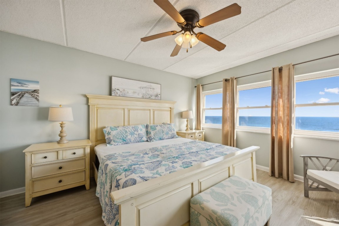 3350 South Fletcher Avenue, Unit 5D Fernandina Beach, FL 32034 - Photo 15 of 48 a bedroom with a bed and a dresser